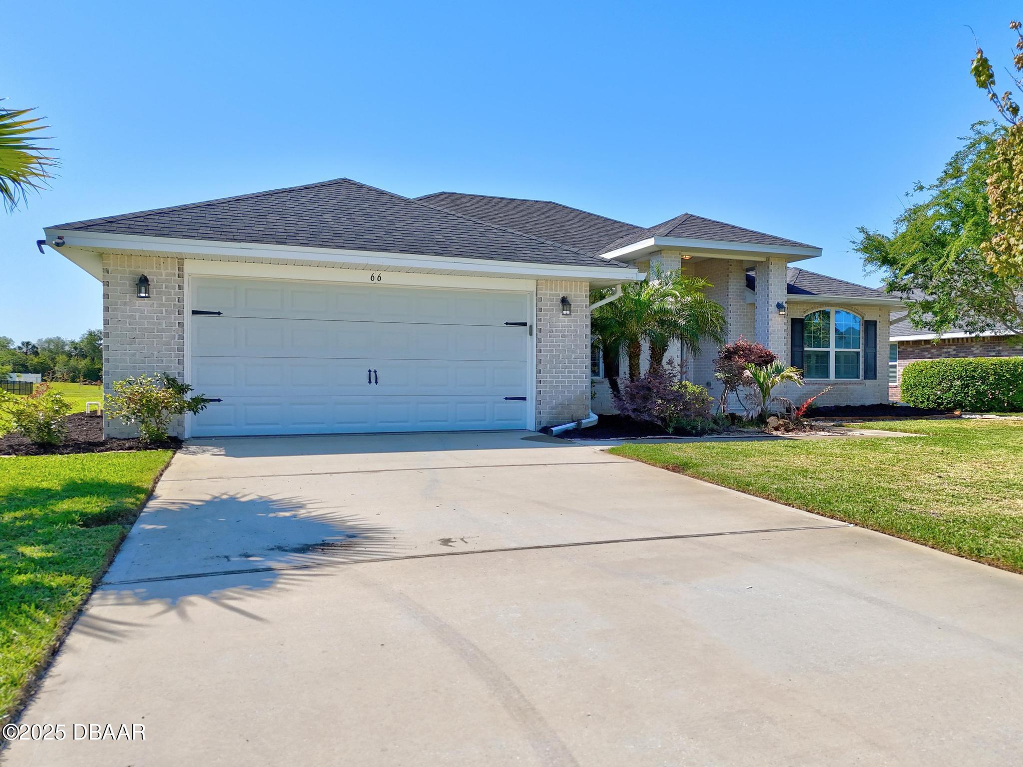 66 Eagle Lake Drive Flagler Beach, FL 32136 - Photo 52 of 77 a front view of house with yard