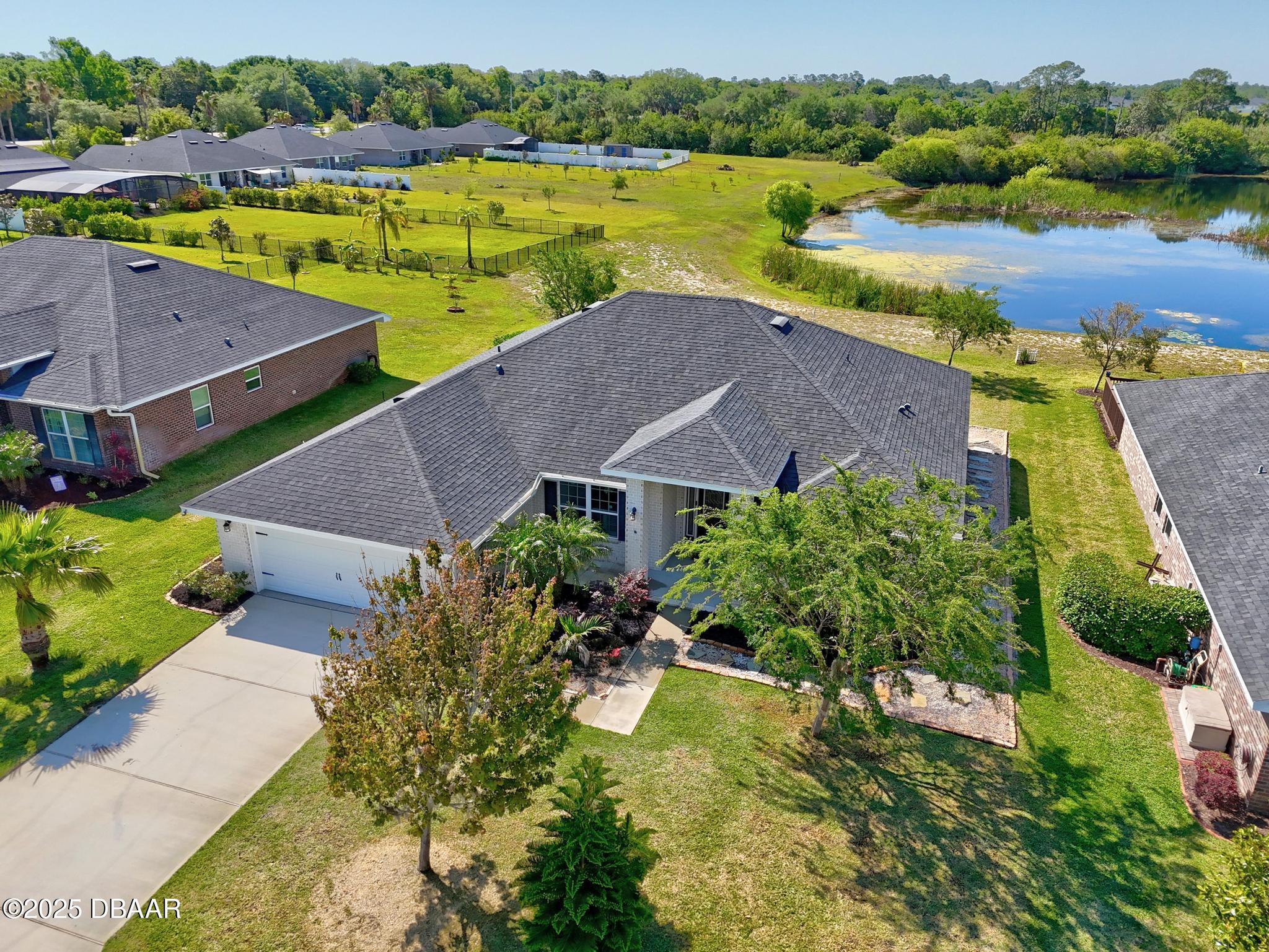 66 Eagle Lake Drive Flagler Beach, FL 32136 - Photo 59 of 77 an aerial view of a house with outdoor space and lake view