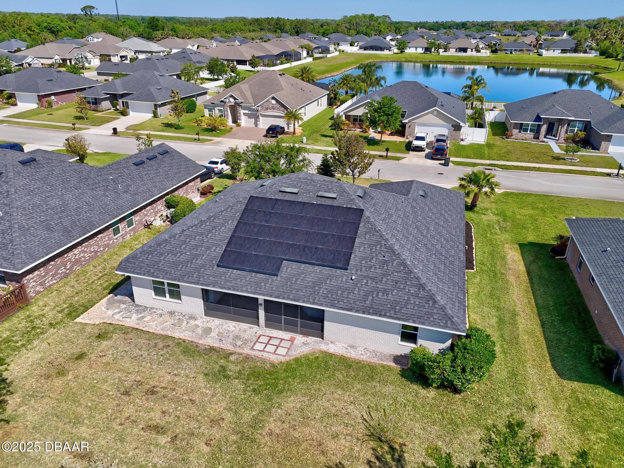 66 Eagle Lake Drive Flagler Beach, FL 32136 - Photo 66 of 77 an aerial view of a house with a swimming pool yard and outdoor seating