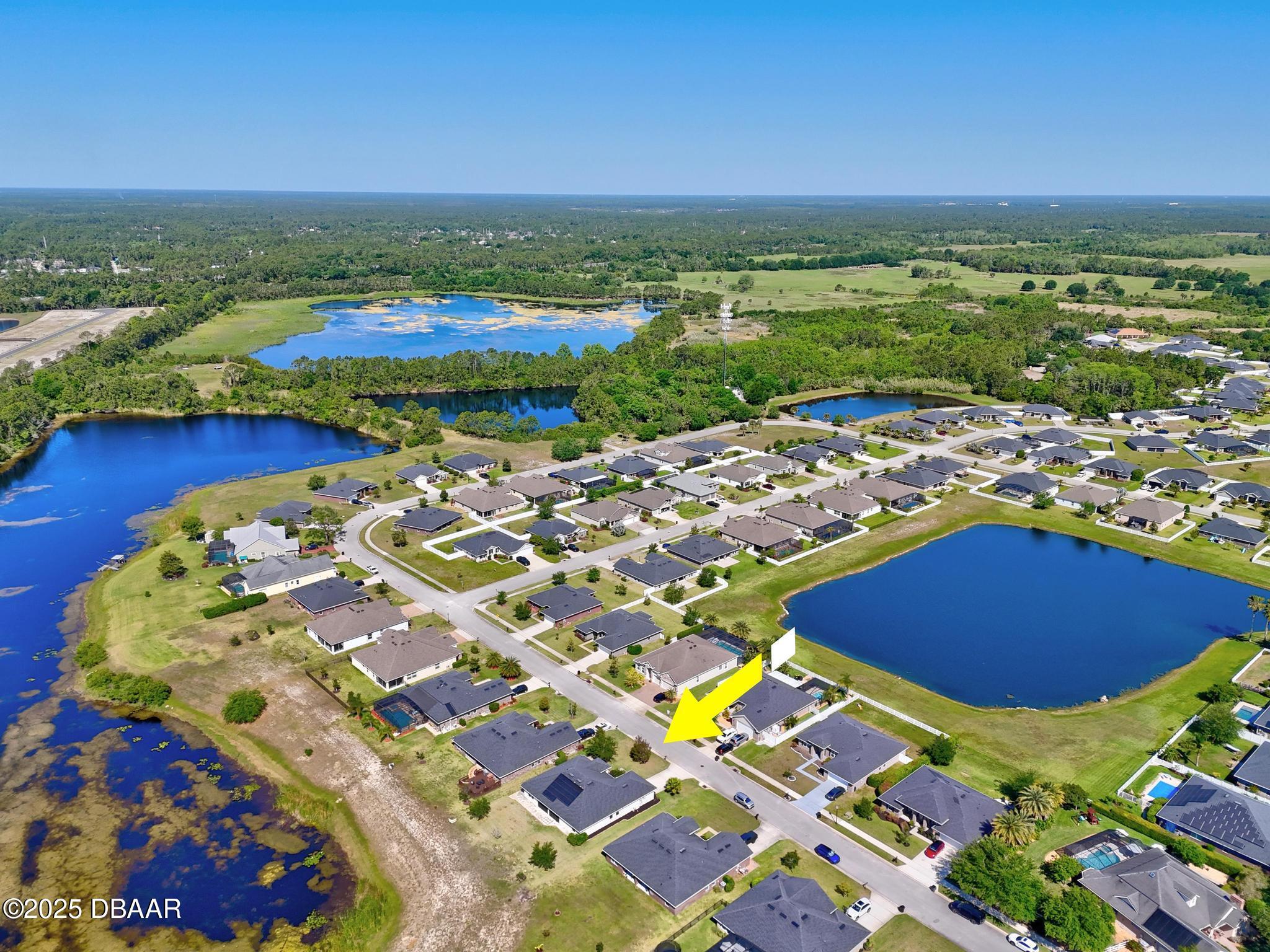 66 Eagle Lake Drive Flagler Beach, FL 32136 - Photo 75 of 77 an aerial view of residential houses with outdoor space