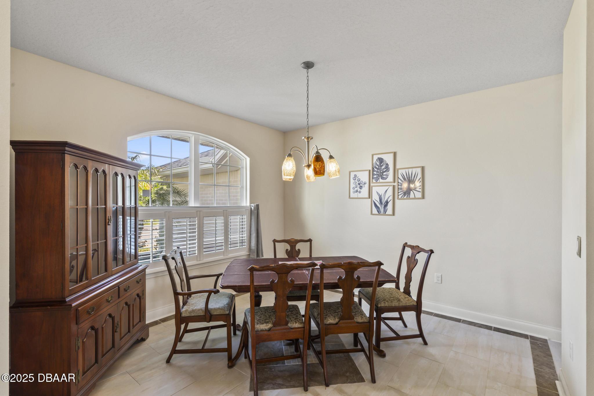 66 Eagle Lake Drive Flagler Beach, FL 32136 - Photo 8 of 77 a view of a dining room with furniture window and outside view