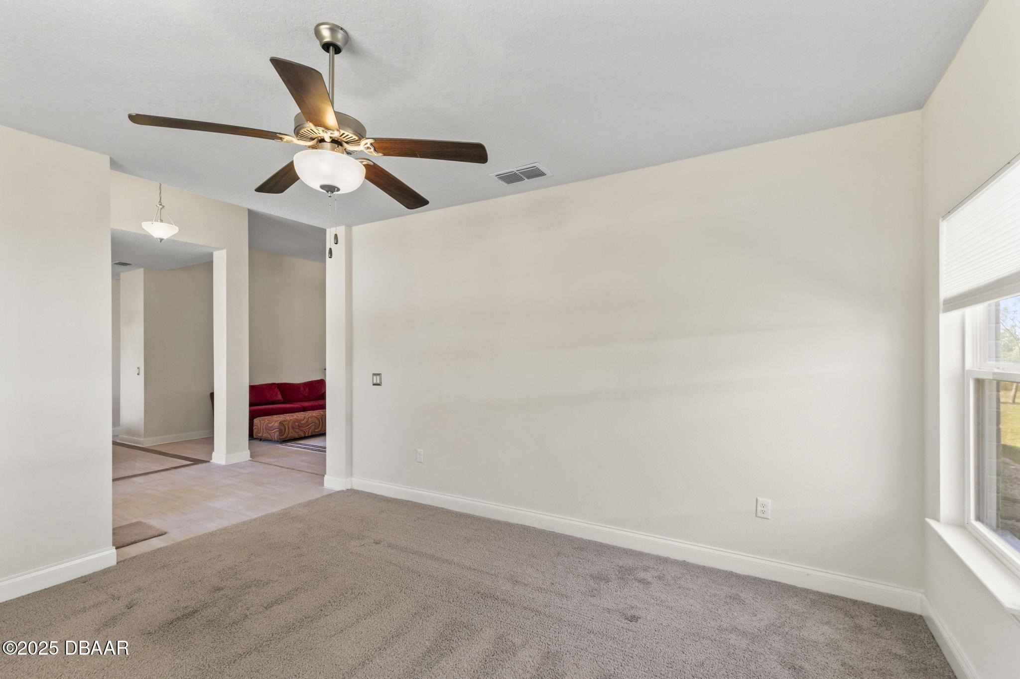 66 Eagle Lake Drive Flagler Beach, FL 32136 - Photo 10 of 77 an empty room with closet and windows