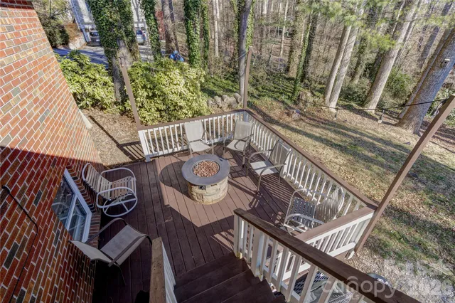a view of a balcony with furniture