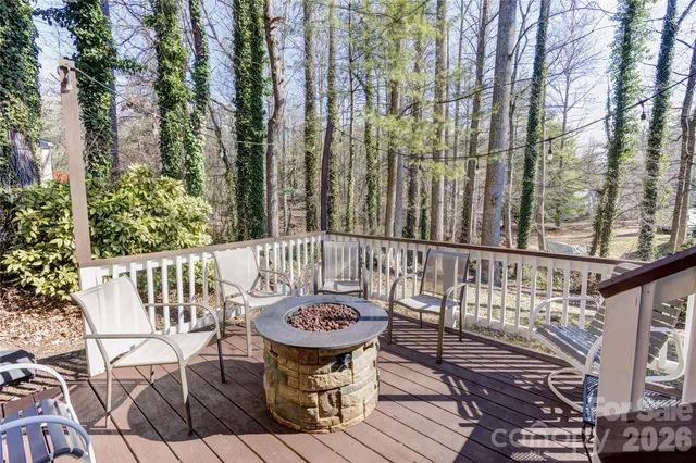 a view of a chair and tables in the balcony