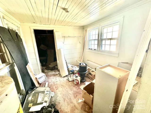 a bed room with a bed and a window