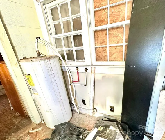 a view of a dining room with furniture a chandelier and wooden floor