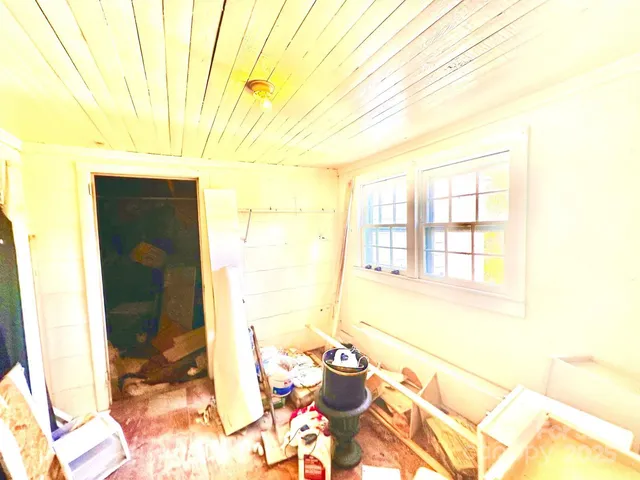a view of a dining room with furniture and a window