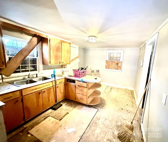 a white toilet sitting next to a sink and vanity