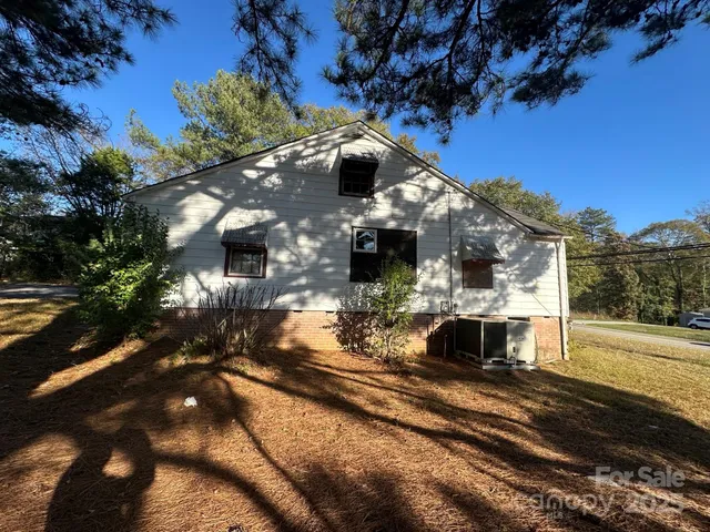 a view of a house with a snow on the road