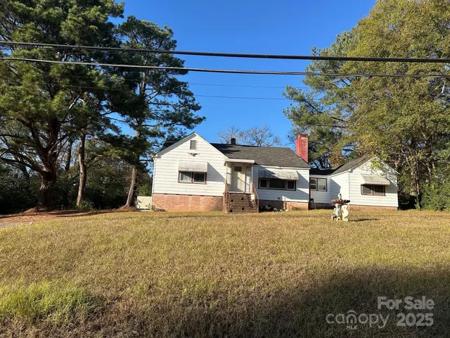 a view of a livingroom with furniture and a window
