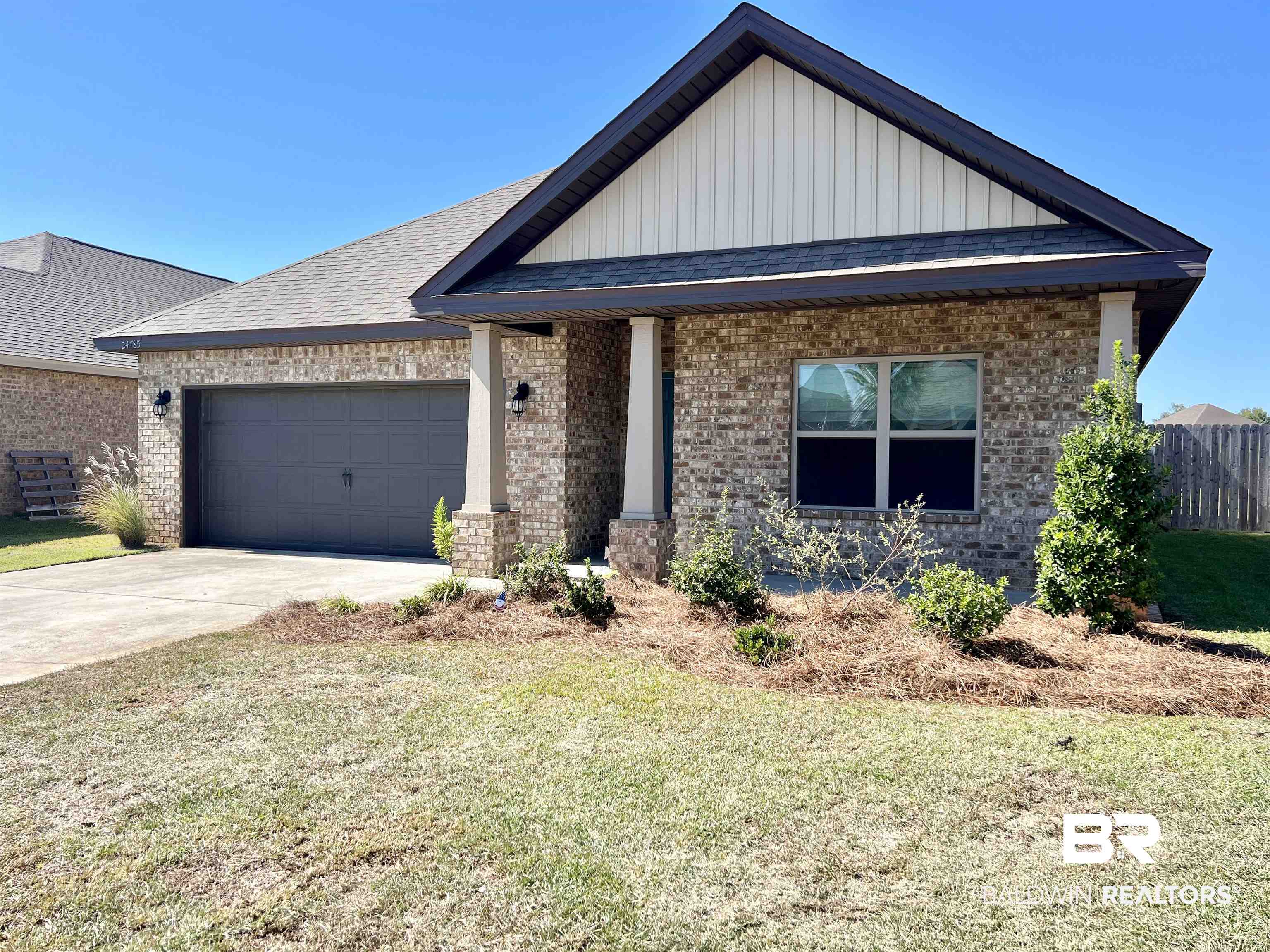 24785 Slater Mill Road Daphne, AL 36526 - Photo 36 of 46 View of front facade with a front yard and a garage