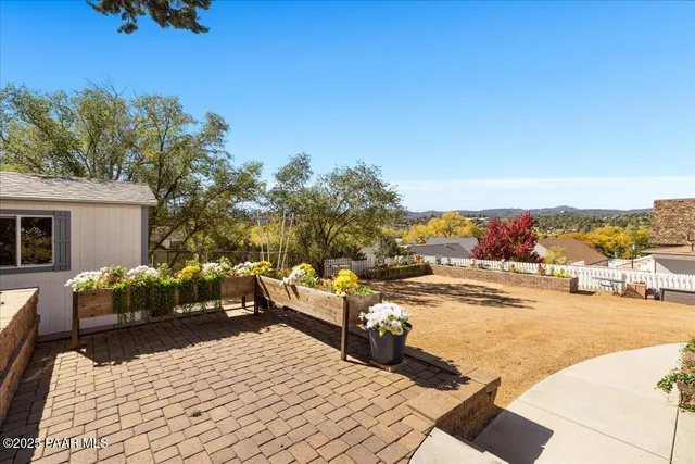 an aerial view of residential house with green space