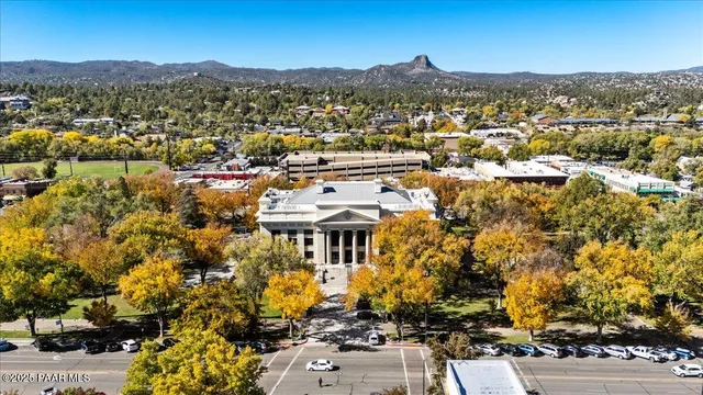 an aerial view of residential building with parking