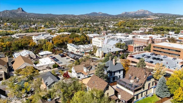 an aerial view of residential houses with outdoor space