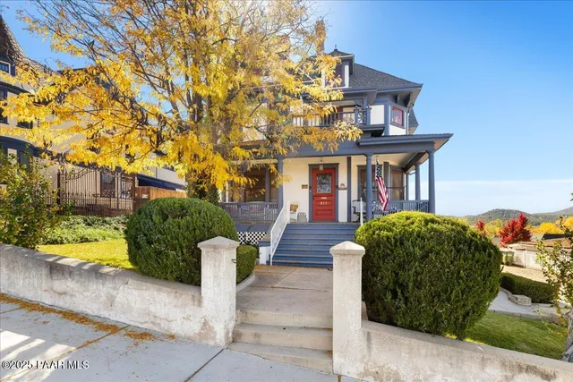 a view of a patio with a table and chairs