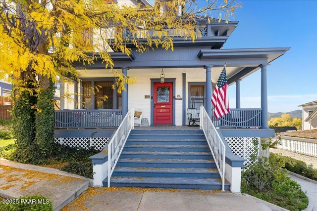 an aerial view of residential house with parking