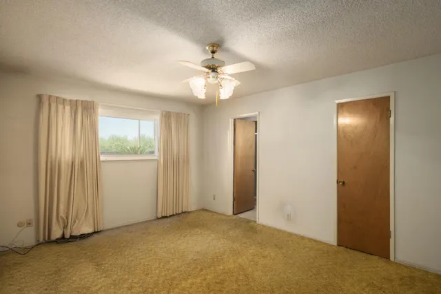 a bathroom with a double vanity sink a mirror and a shower