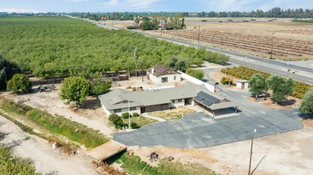 an aerial view of a house with a lake view