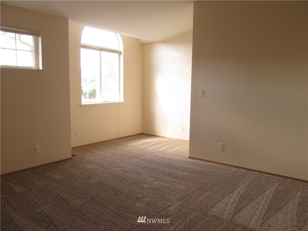 11224 Southeast 188th Place Renton, WA 98055 - Photo 11 of 16 an empty room with windows