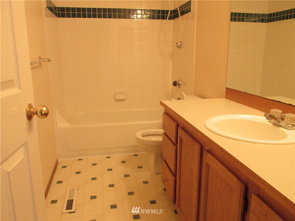 11224 Southeast 188th Place Renton, WA 98055 - Photo 13 of 16 a bathroom with a sink a toilet and shower