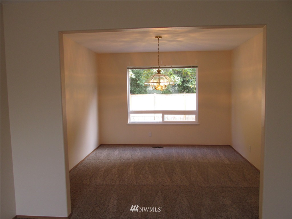 11224 Southeast 188th Place Renton, WA 98055 - Photo 6 of 16 a view of an empty room with a window