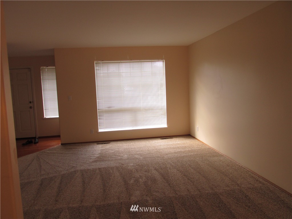 11224 Southeast 188th Place Renton, WA 98055 - Photo 7 of 16 an empty room with windows