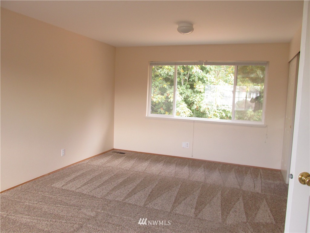 11224 Southeast 188th Place Renton, WA 98055 - Photo 9 of 16 an empty room with a window