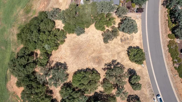 a view of a house with snow on the road