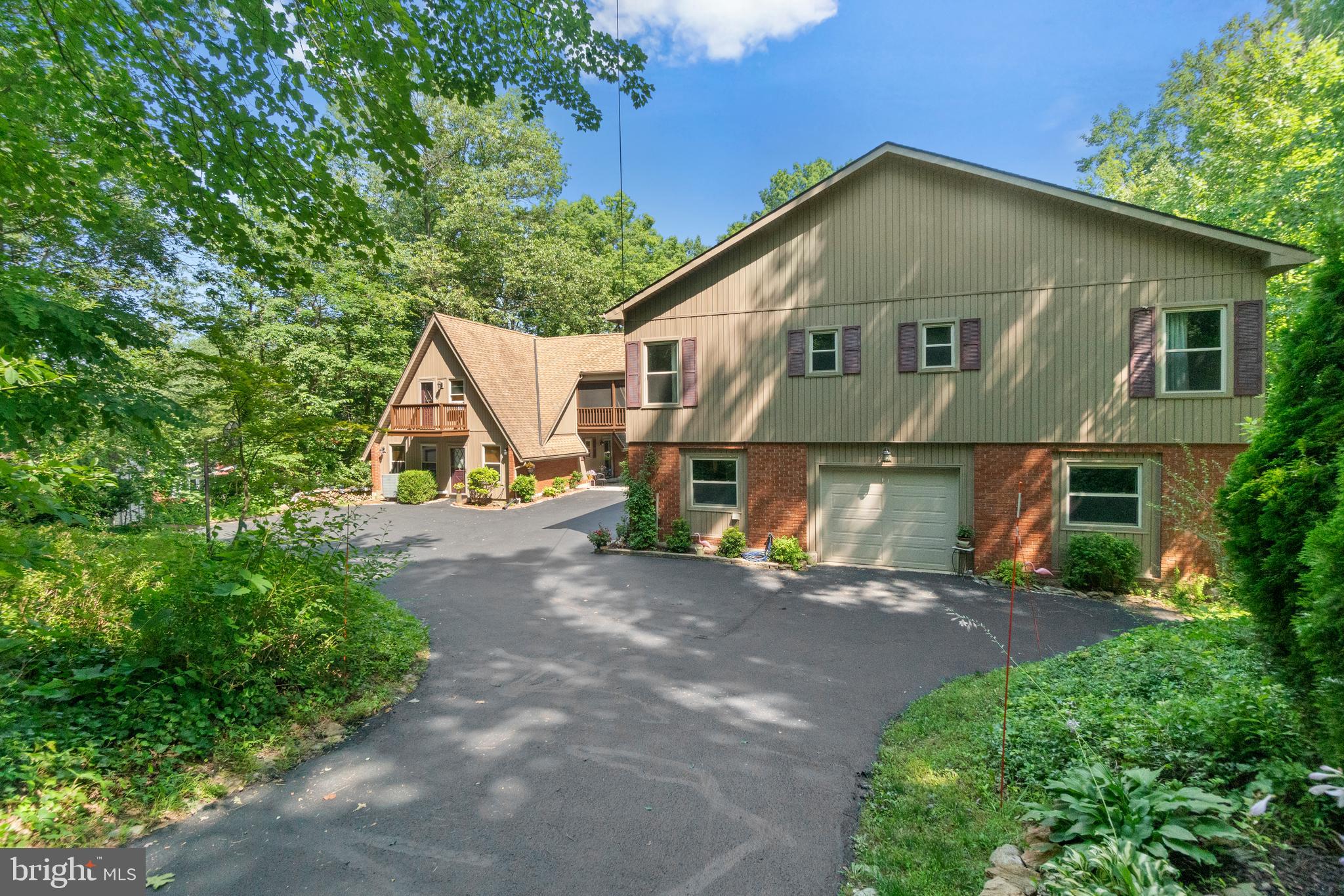 Main house on right, A-Frame on left  1-car garage