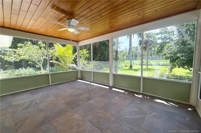 a view of an empty room with a large window