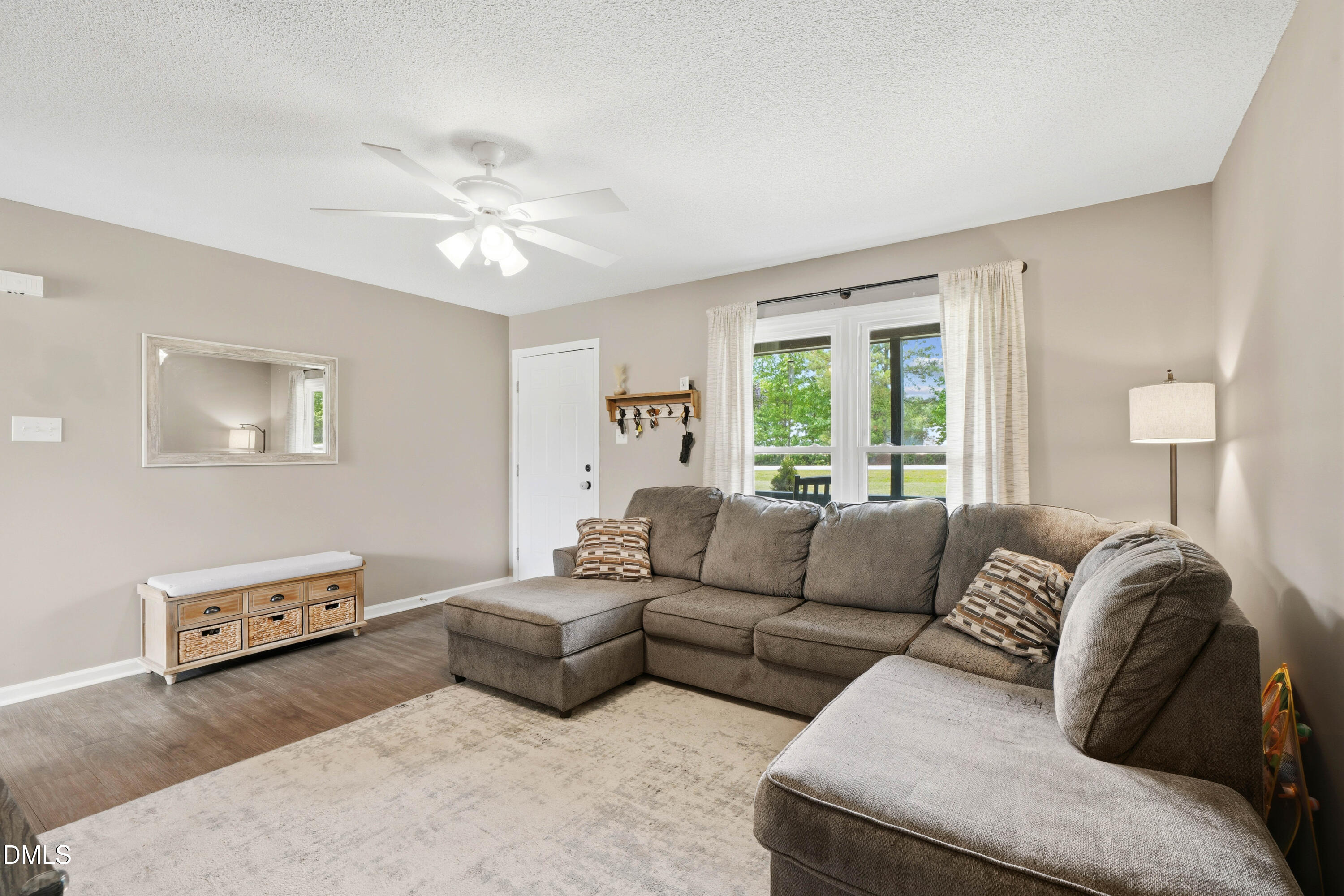 101 Stephenson Road Benson, NC 27504 - Photo 7 of 29 a living room with furniture and a window