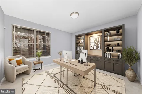 a view of a park with trees and wooden fence