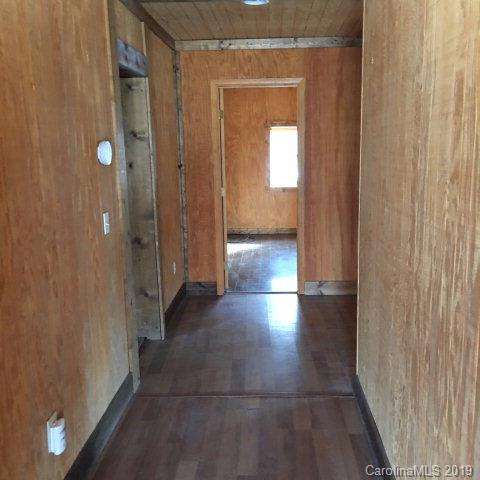 660 Rolands Chapel Road Nebo, NC 28761 - Photo 2 of 14 a view of a hallway with wooden shelves