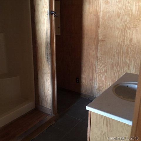 660 Rolands Chapel Road Nebo, NC 28761 - Photo 5 of 14 an empty room with wooden floor