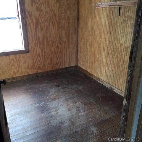660 Rolands Chapel Road Nebo, NC 28761 - Photo 7 of 14 a view of a small space with wooden floor and a window