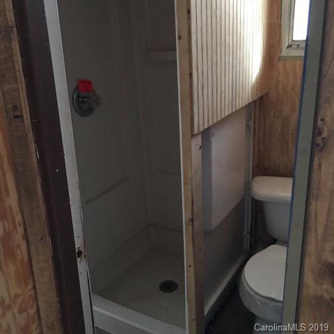 660 Rolands Chapel Road Nebo, NC 28761 - Photo 8 of 14 a white toilet sitting next to a shower