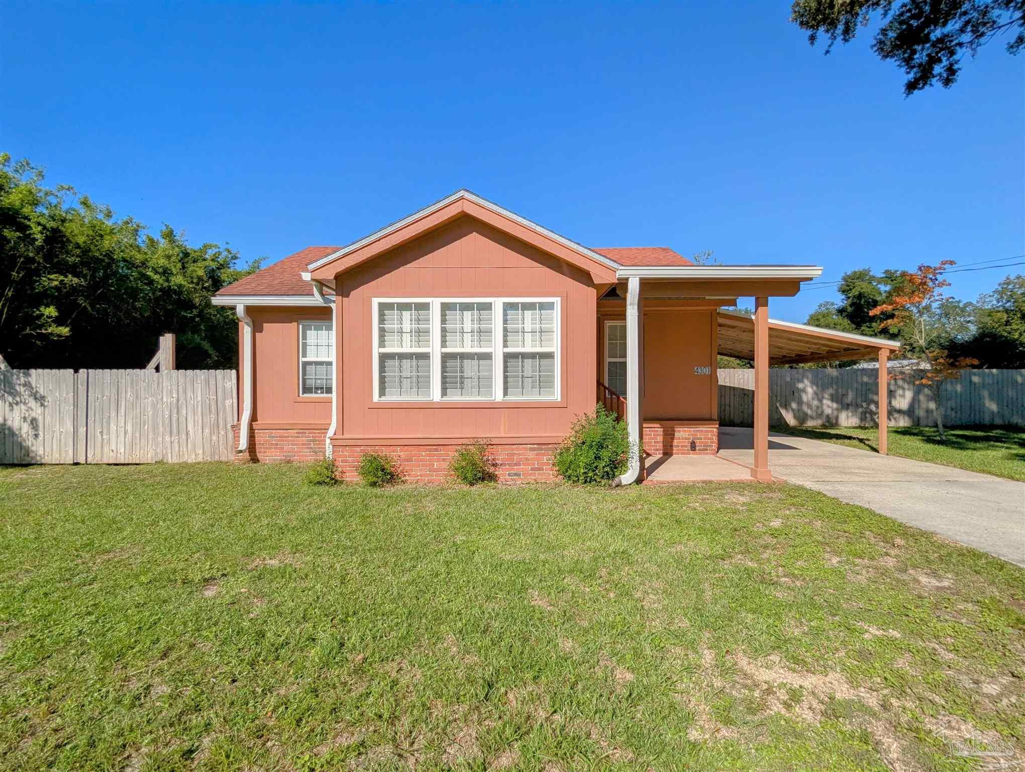4301 Willow Street Pace, FL 32571 - Photo 1 of 25 a view of a house with a yard