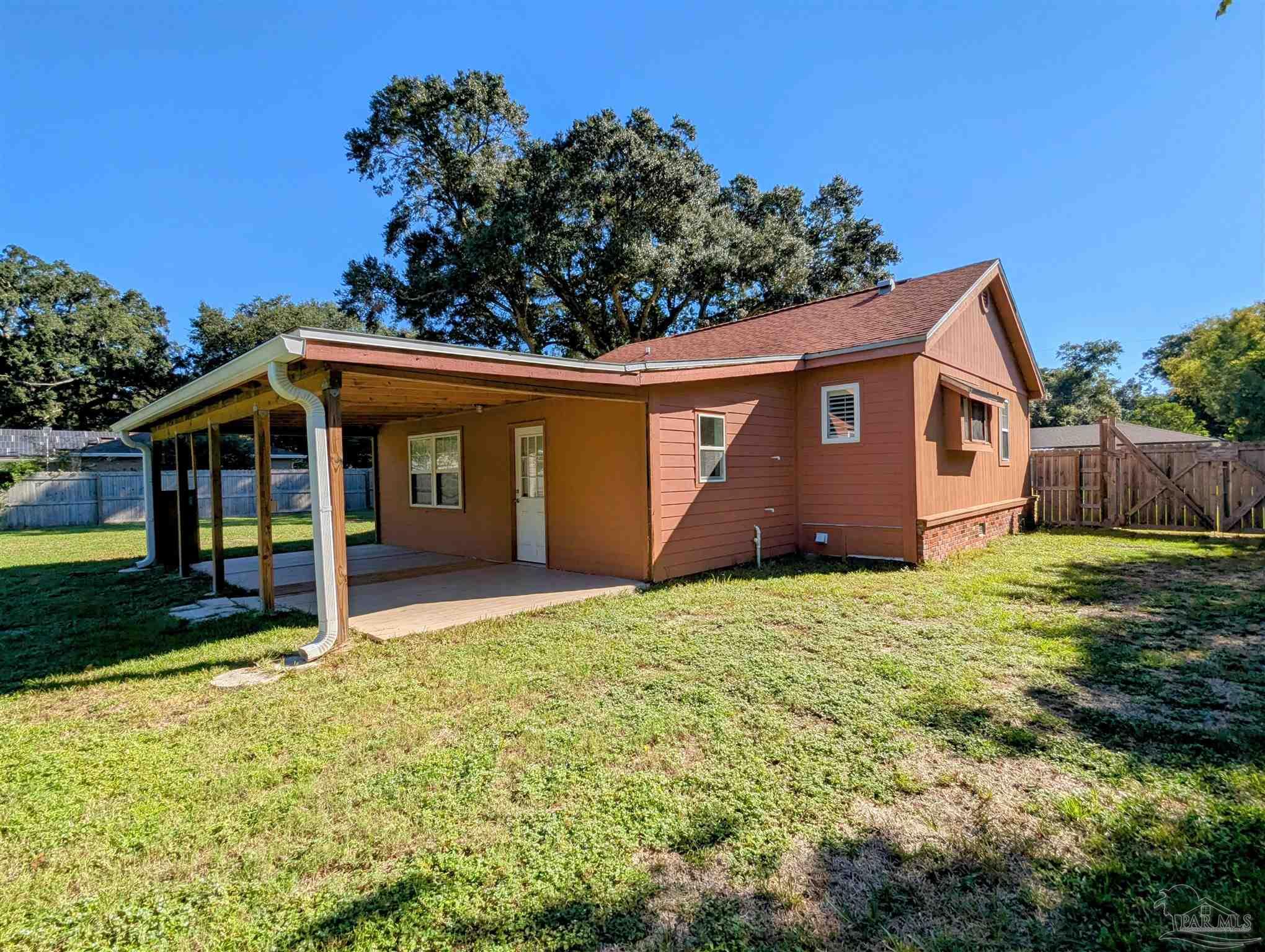 4301 Willow Street Pace, FL 32571 - Photo 21 of 25 a house with garden in front of it