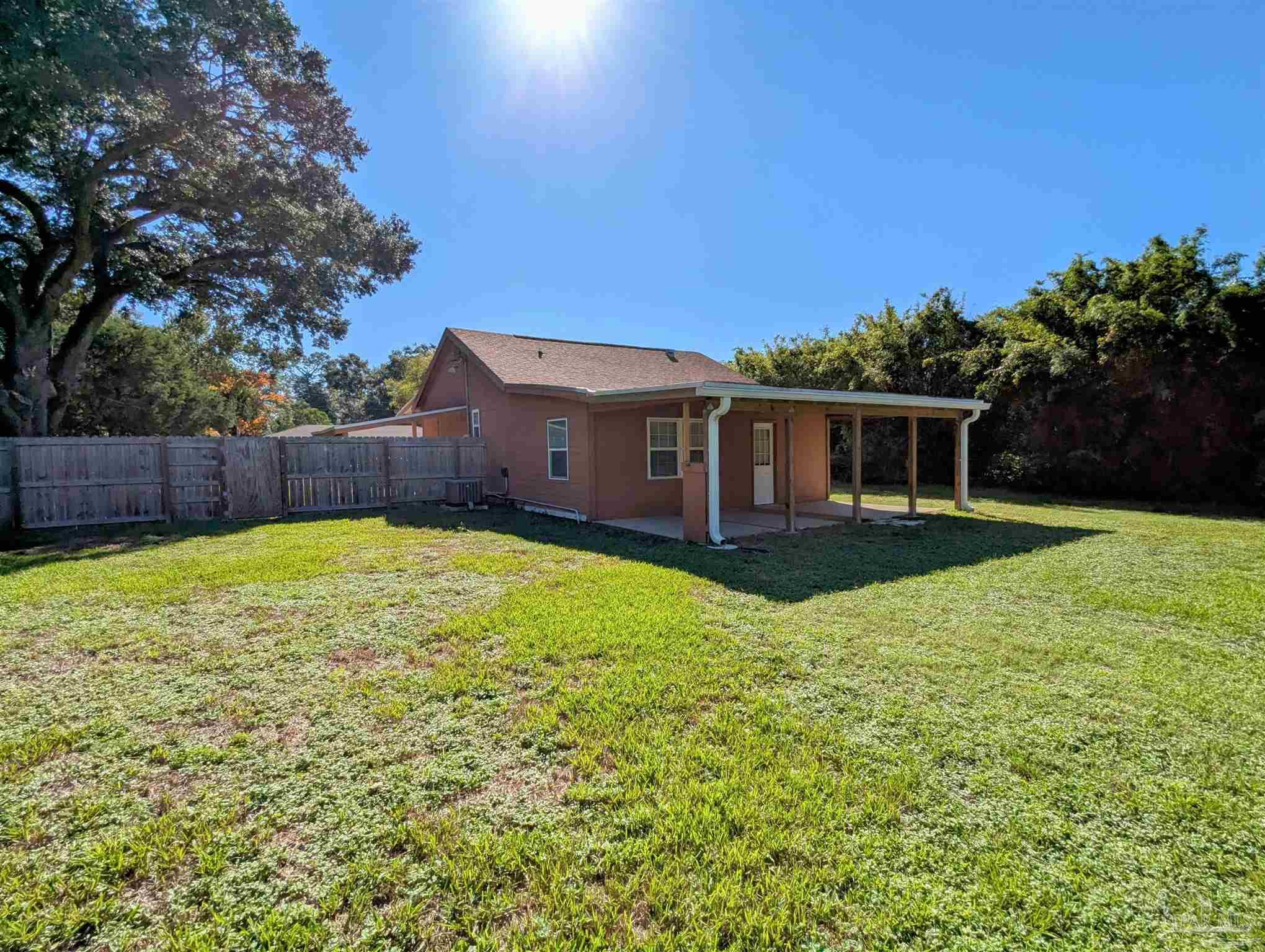 4301 Willow Street Pace, FL 32571 - Photo 23 of 25 front view of a house with a yard