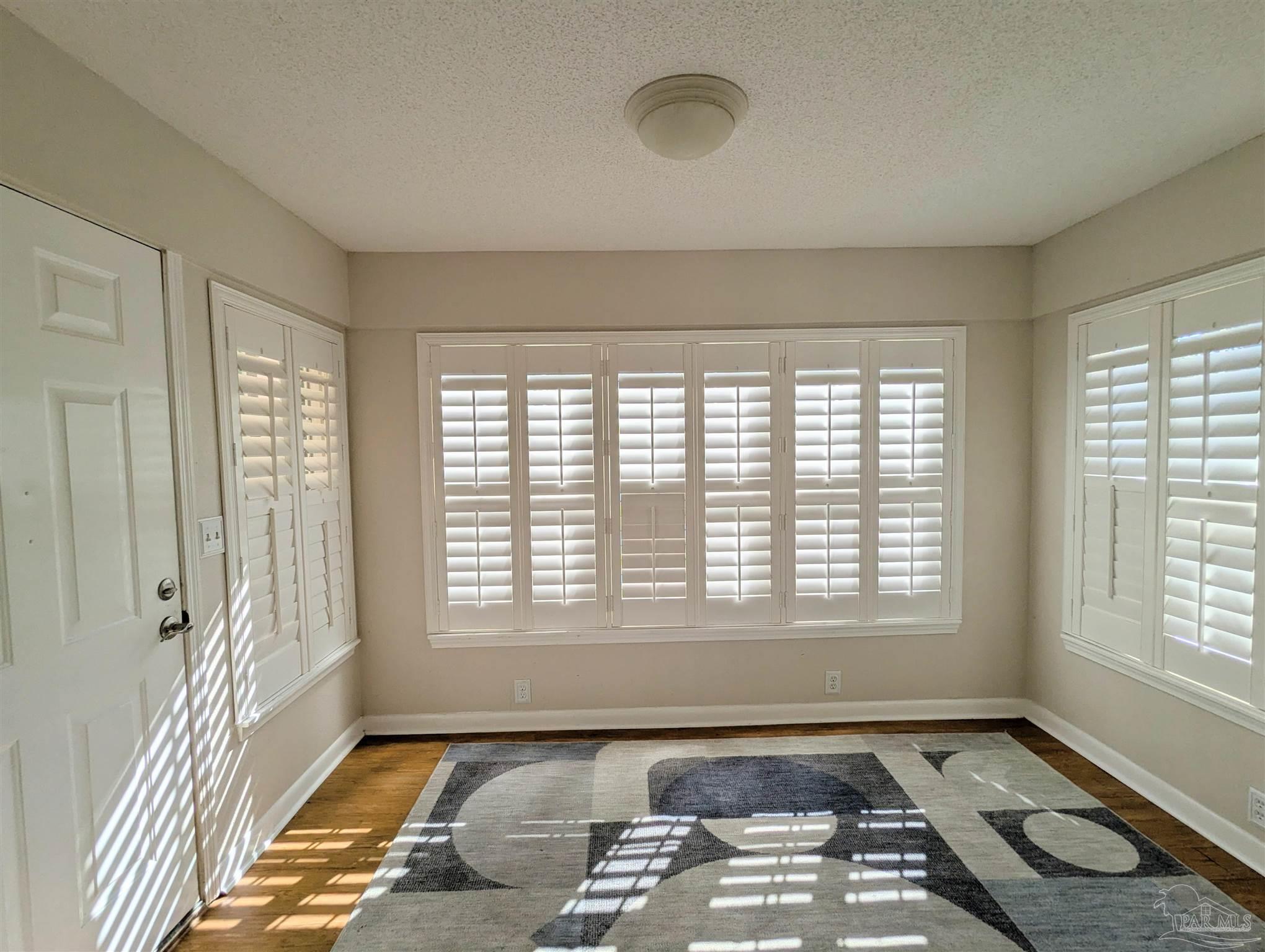4301 Willow Street Pace, FL 32571 - Photo 7 of 25 a view of a livingroom with a fireplace and a window