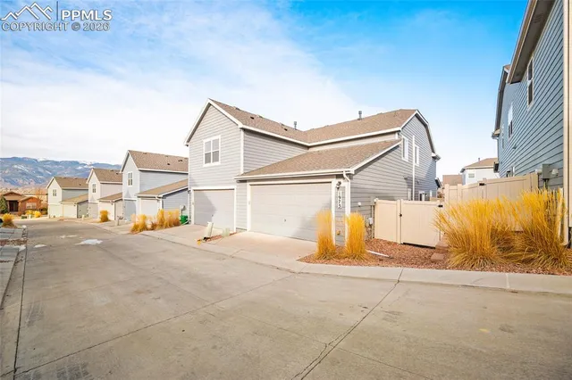 an aerial view of residential building and car parked