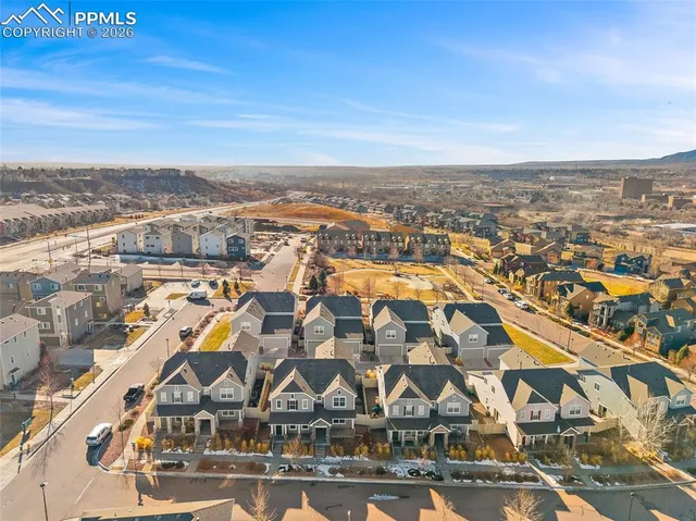 an aerial view of residential houses with outdoor space