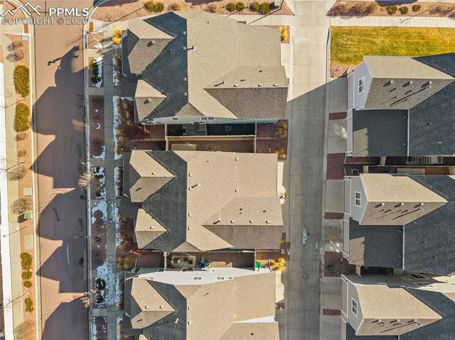 an aerial view of a city with lots of residential buildings