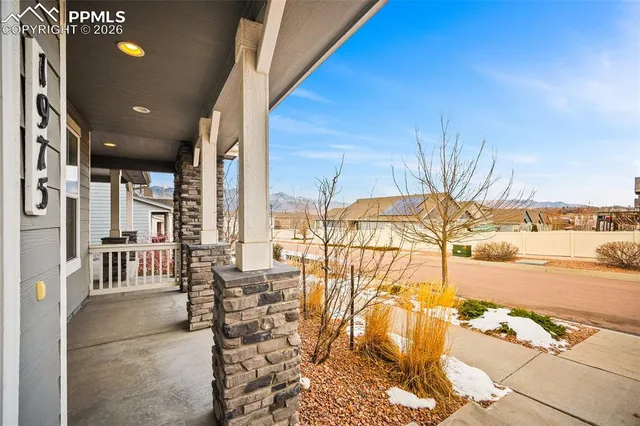 a lobby with furniture and floor to ceiling window