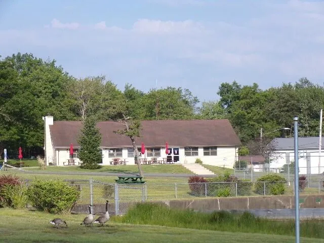 a view of house with a big yard