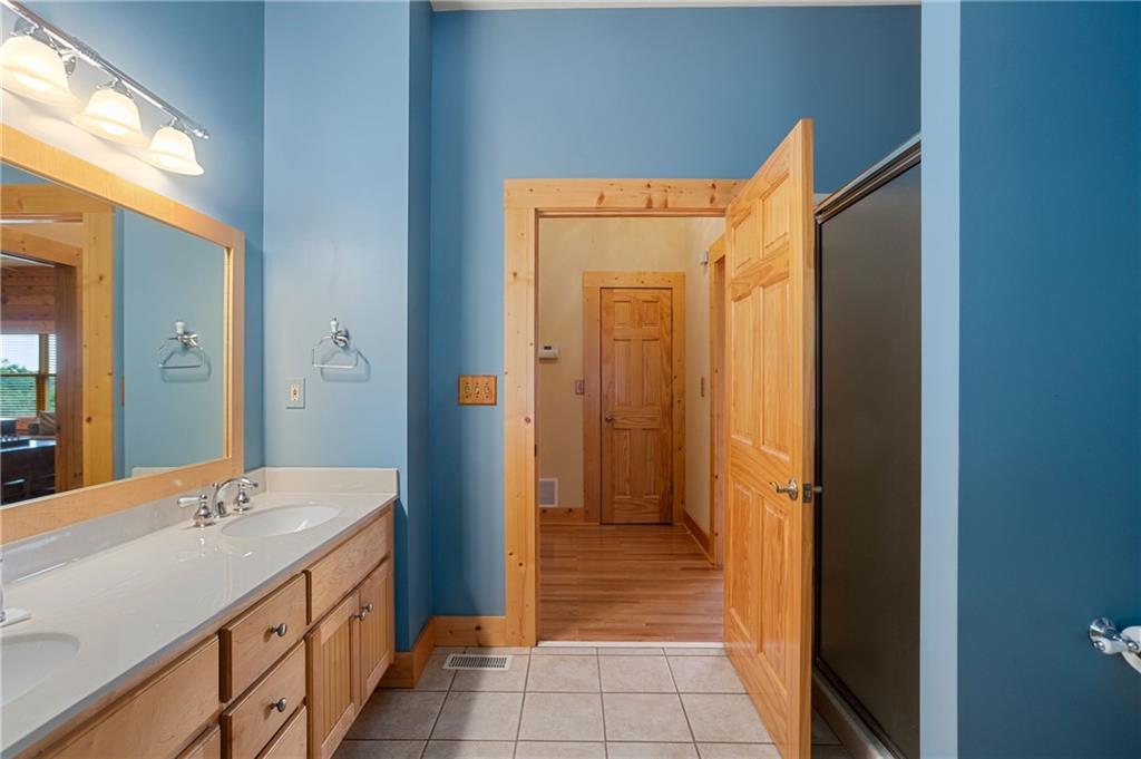 729 Huckleberry Way Jasper, GA 30143 - Photo 20 of 74 a bathroom with a sink and a mirror