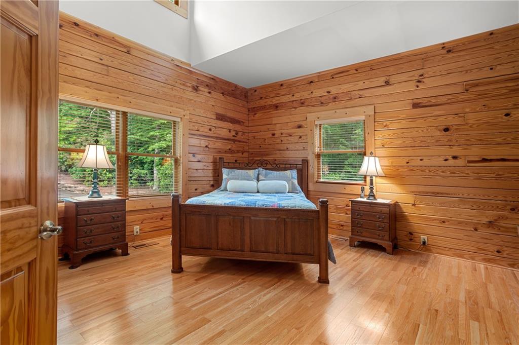 729 Huckleberry Way Jasper, GA 30143 - Photo 21 of 74 a bedroom with furniture and wooden floor