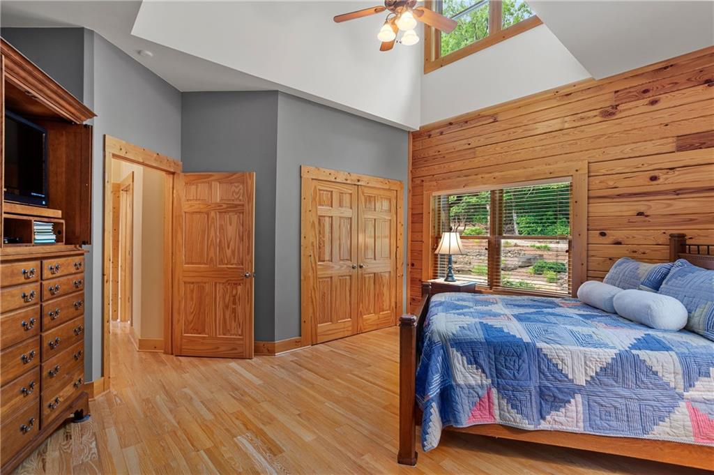 729 Huckleberry Way Jasper, GA 30143 - Photo 22 of 74 a bedroom with a bed and wooden floor