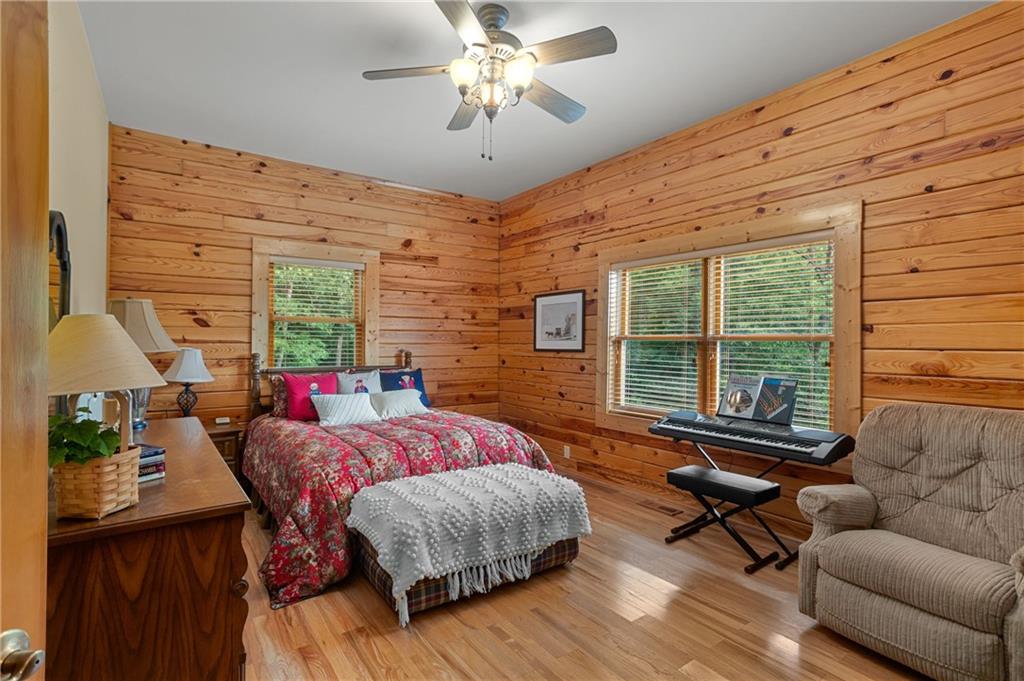 729 Huckleberry Way Jasper, GA 30143 - Photo 23 of 74 a bedroom with furniture and a large window