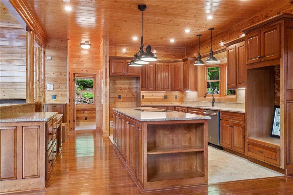 729 Huckleberry Way Jasper, GA 30143 - Photo 31 of 74 a kitchen with counter top space and wooden floor